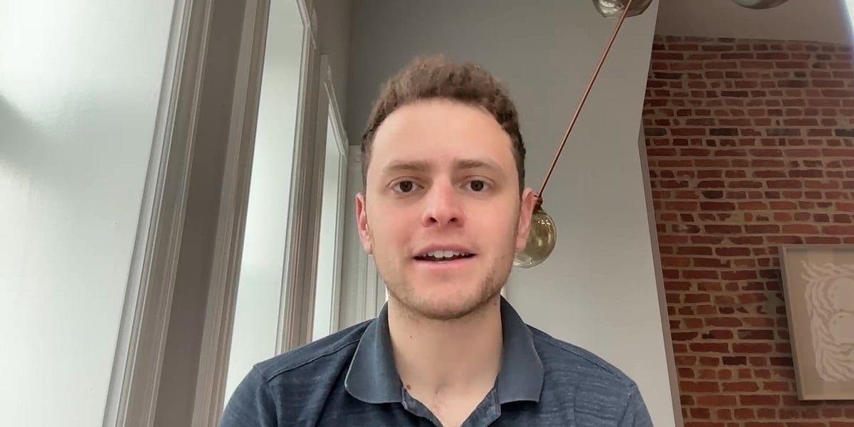 Stock market display showing declining numbers amid U.S.-China trade tensions and recession concerns