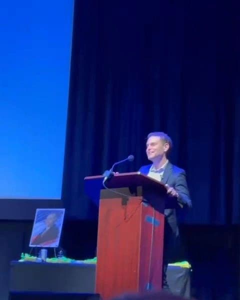 Aaron Parnas receiving the Defender of Gen Z award at The Jim Acosta Show's first live event